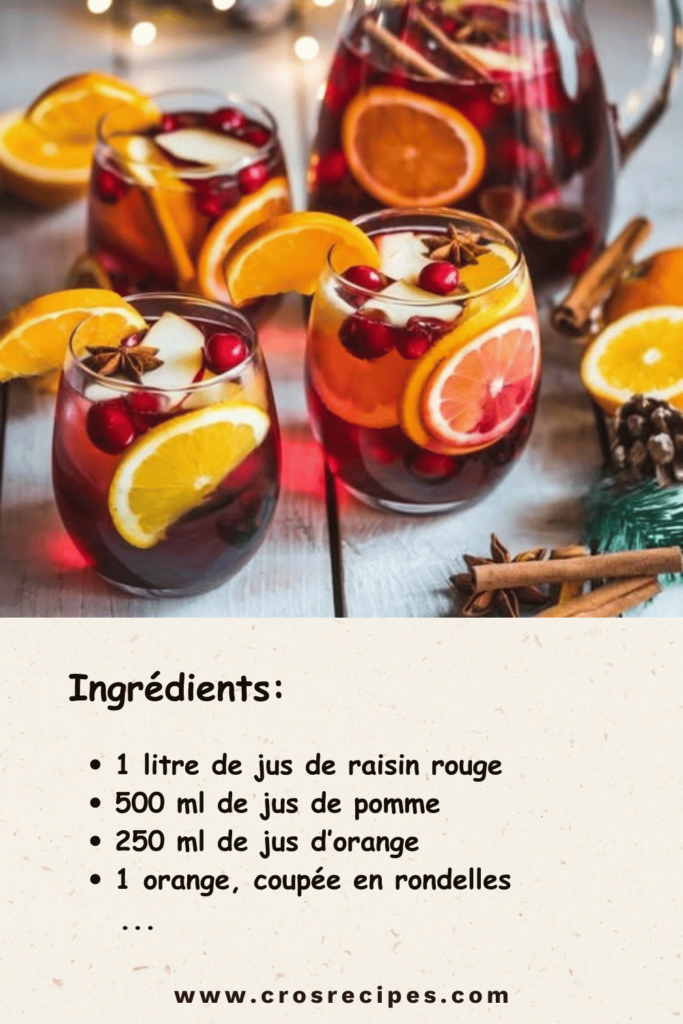 Sangria de Noël sans alcool servie dans des verres décorés de fruits et menthe.