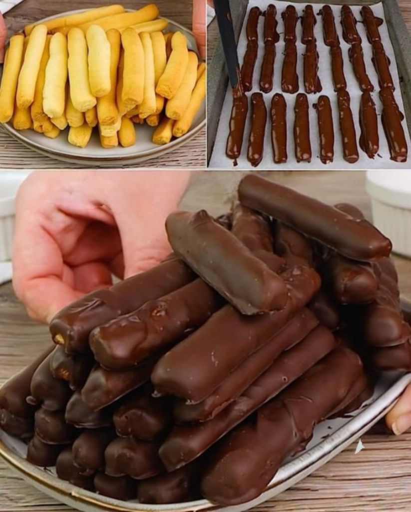 Bâtonnets de biscuit dorés, enrobés de chocolat brillant, alignés sur du papier sulfurisé.