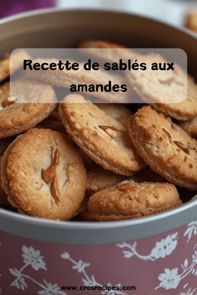 Sablés aux amandes dorés et croustillants, joliment disposés sur une assiette, avec une amande entière au centre pour une touche décorative.