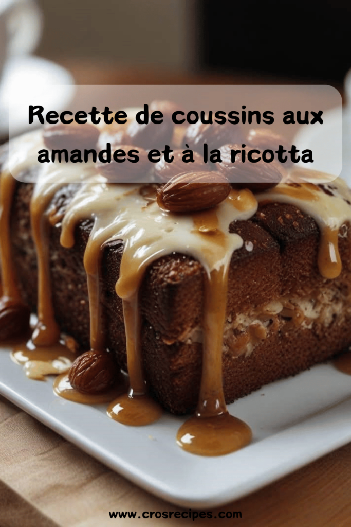 Coussins moelleux à la ricotta et aux amandes, dorés au four, arrosés de miel et saupoudrés d’amandes effilées, servis sur une assiette élégante.