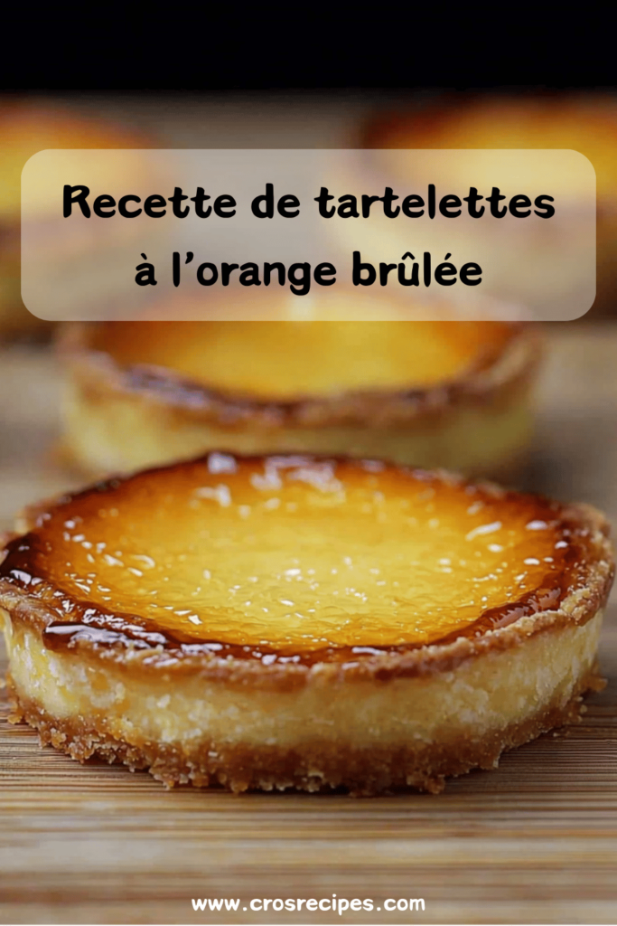 Tartelettes dorées à l’orange, garnies d’une crème onctueuse et surmontées d’une fine couche de caramel brûlé, servies sur une assiette élégante.