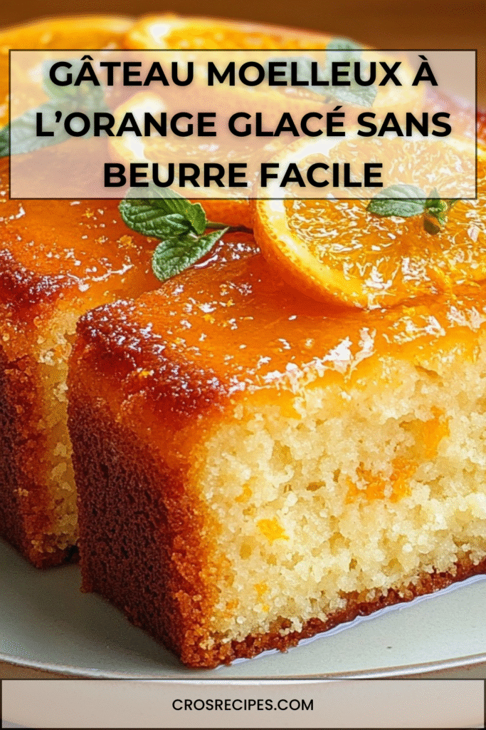 Gâteau moelleux à l’orange nappé d’un glaçage brillant avec rondelles d’orange en décor.