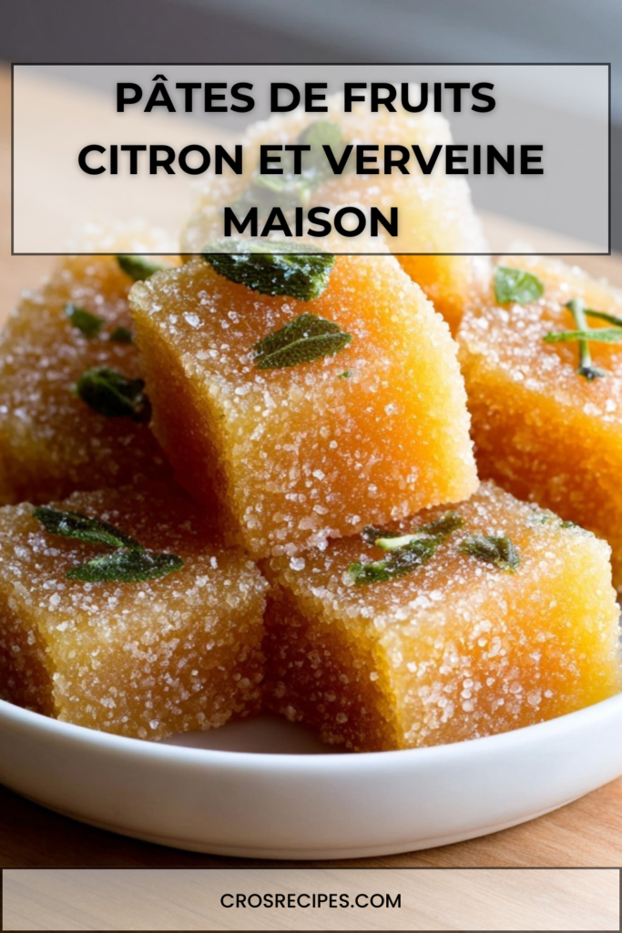 Pâtes de fruits citron et verveine coupées en cubes, roulées dans le sucre cristal, à la texture lisse et brillante.