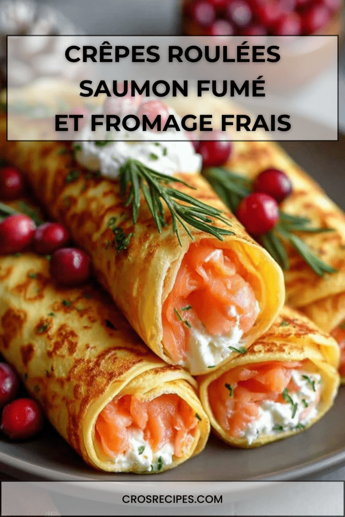 Crêpes roulées garnies de fromage frais citronné, saumon fumé, aneth et canneberges, dressées en entrée festive.