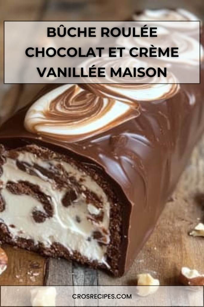 Bûche roulée au chocolat garnie de crème vanillée, recouverte d’une ganache brillante et décorée de fruits secs.