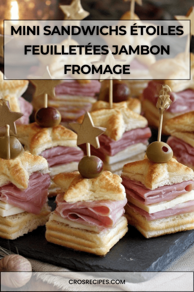 Mini sandwichs étoiles feuilletées garnies de jambon et fromage, montées en sandwichs et décorées d’une olive sur un pic, présentées sur un plateau festif