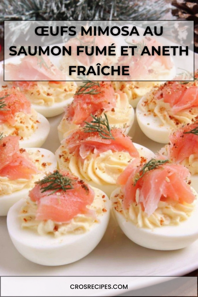 Assiette d’œufs mimosa garnis de crème aux jaunes d’œufs et mayonnaise, décorés de lanières de saumon fumé et d’aneth frais finement ciselé