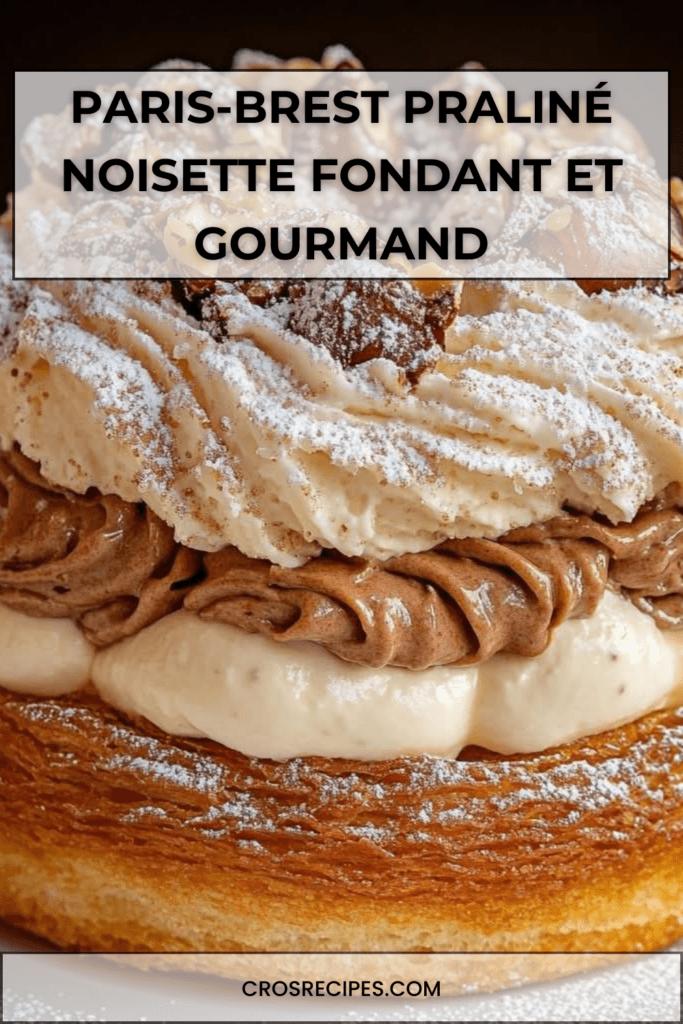 Paris-Brest praliné noisette coupé en deux, garni de crème pralinée et chantilly, décoré de noisettes concassées et sucre glace.