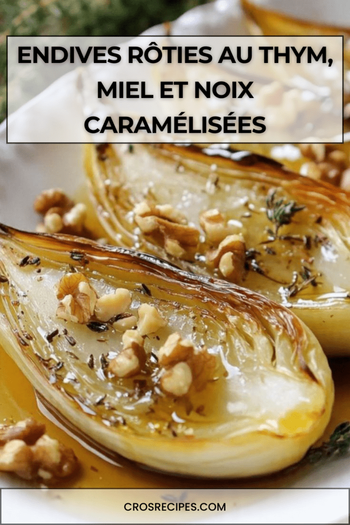 Endives rôties au four nappées de miel, parsemées de noix de Grenoble et thym frais, dorées et caramélisées dans un plat rustique.