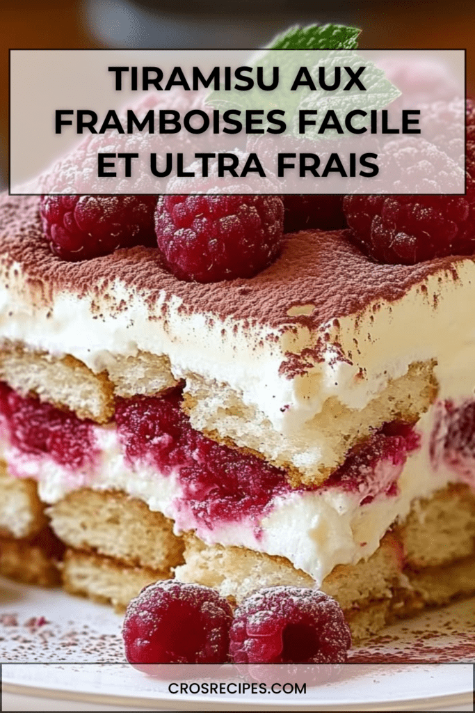 Tiramisu aux framboises en plat familial, couches de crème mascarpone et biscuits imbibés, décoré de framboises fraîches et menthe.