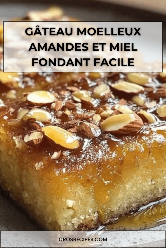 Gâteau moelleux aux amandes imbibé de miel, doré et décoré d’amandes croquantes sur le dessus, servi en part sur une assiette