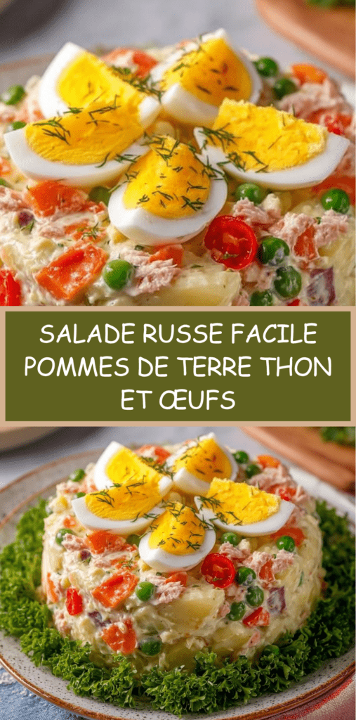 Salade russe crémeuse avec pommes de terre en dés, thon émietté, œufs en quartiers, petits pois et carottes, décorée d’herbes fraîches.